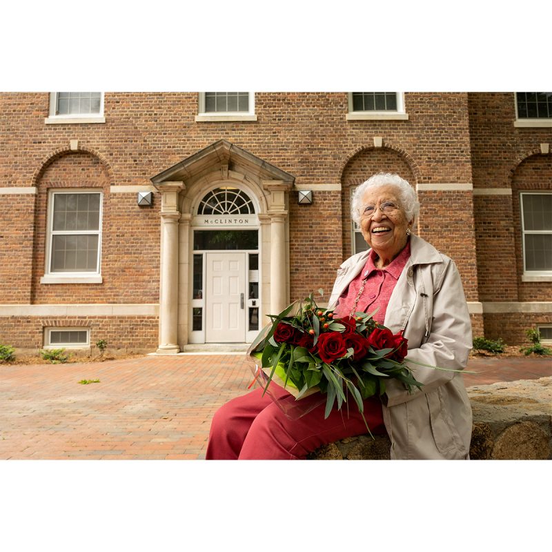 Hortense McClinton sitting in front of a dormitory named after her on the campus of UNC-Chapel Hill.
